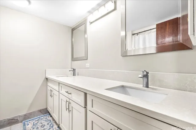 a bathroom with a sink and a mirror