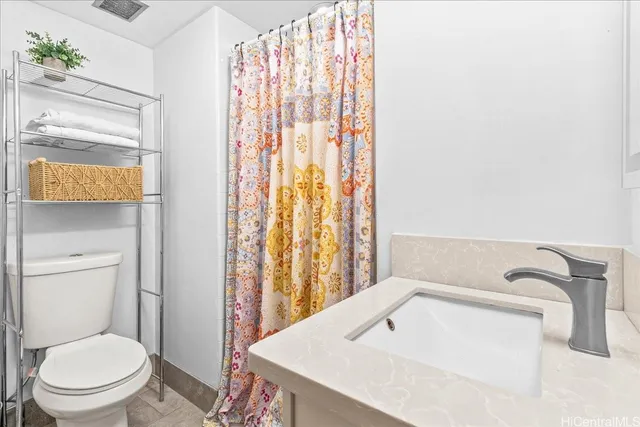 a bathroom with a toilet and a sink