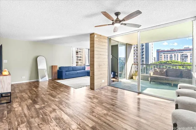 a living room with couch and wooden floor