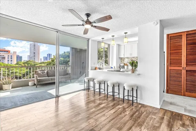 a view of a living room and a balcony