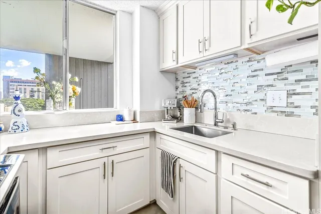 a kitchen with appliances cabinets and a counter top space