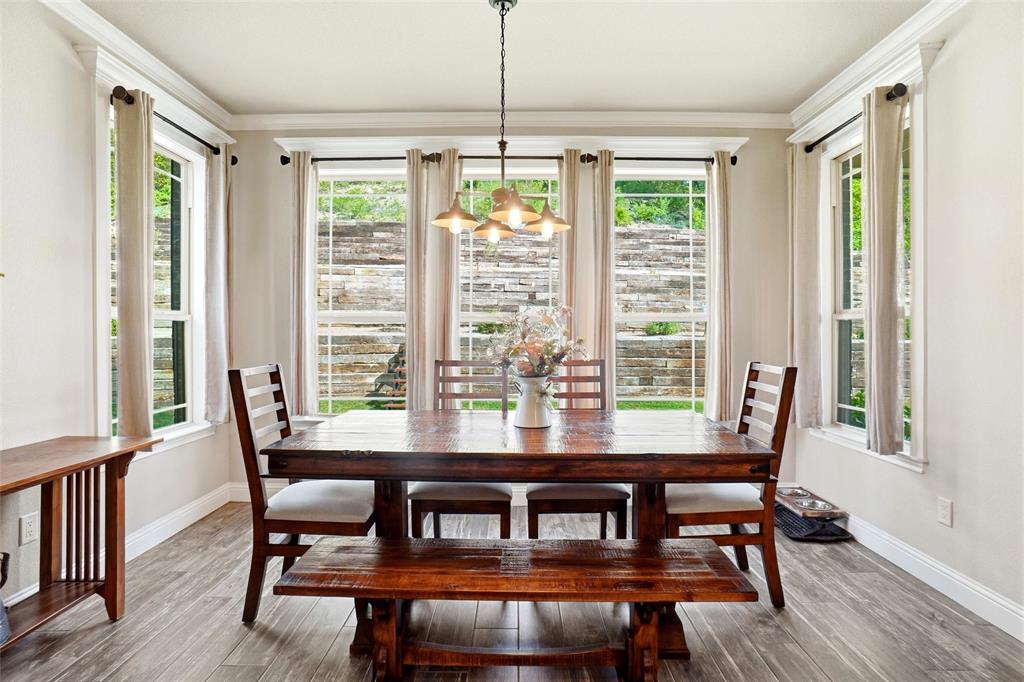 1024 Tex Lane Springtown, TX 76082 - Photo 16 of 40 a view of a dining room with furniture window and wooden floor