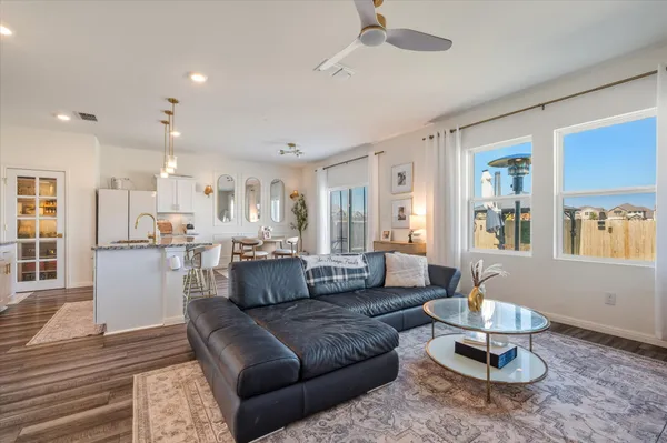 a living room with furniture or couch and a dining table