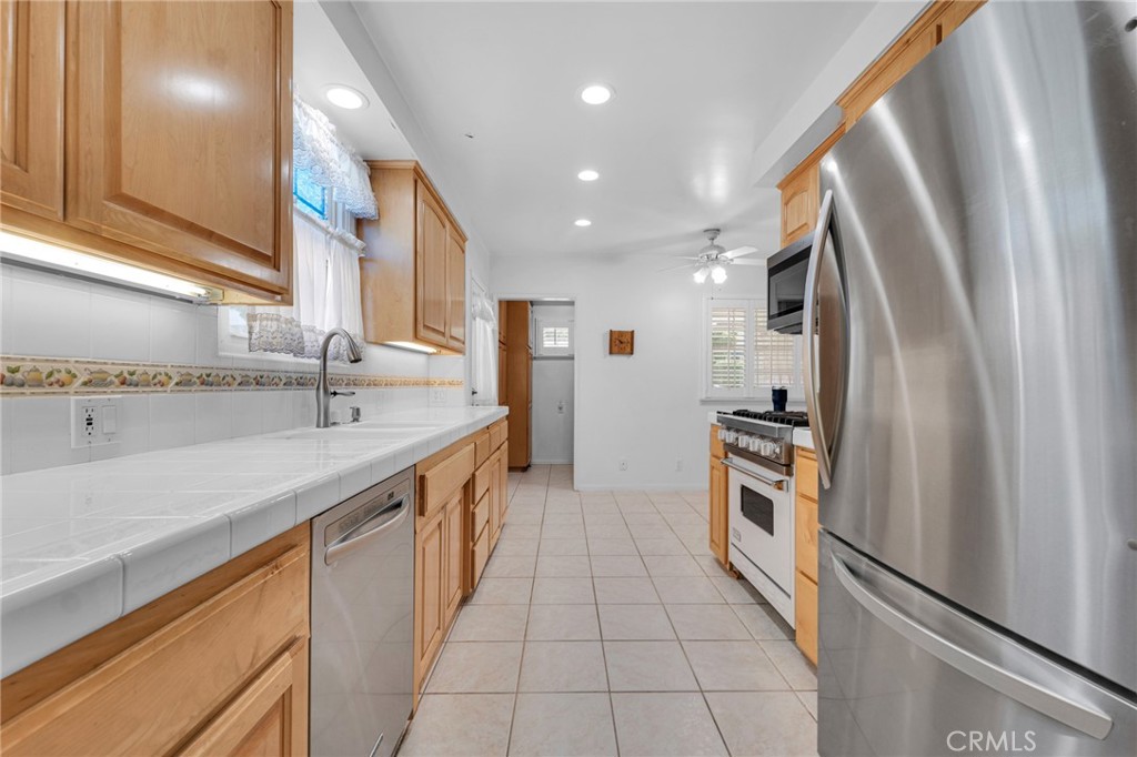 2107 Jolley Drive Burbank, CA 91504 - Photo 11 of 33 a kitchen with stainless steel appliances granite countertop a refrigerator and a sink