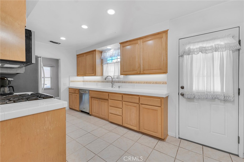 2107 Jolley Drive Burbank, CA 91504 - Photo 12 of 33 a kitchen with a sink stove and cabinets