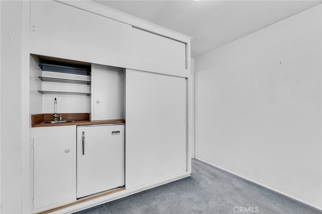 2107 Jolley Drive Burbank, CA 91504 - Photo 17 of 33 a kitchen with white cabinets and white appliances