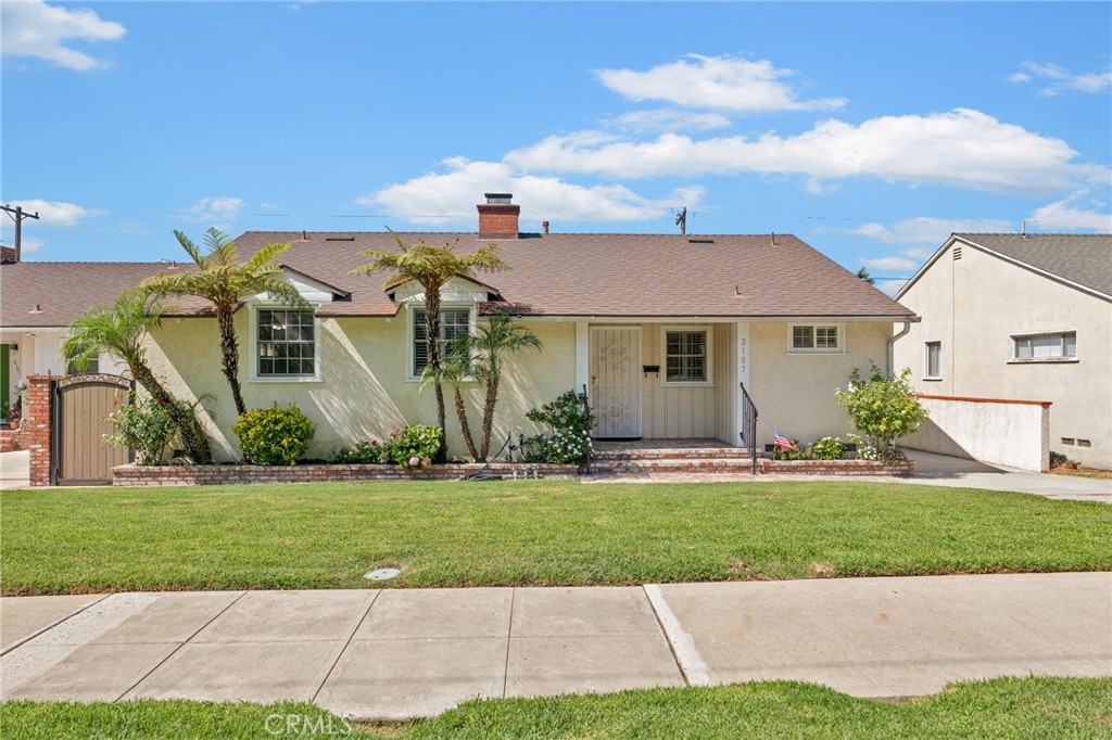 2107 Jolley Drive Burbank, CA 91504 - Photo 2 of 33 a front view of a house with a yard and garage