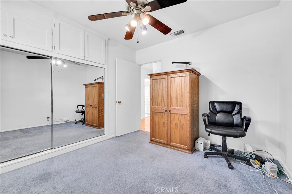 2107 Jolley Drive Burbank, CA 91504 - Photo 22 of 33 a view of a workspace with furniture and a ceiling fan