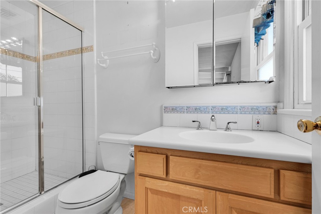 2107 Jolley Drive Burbank, CA 91504 - Photo 28 of 33 a bathroom with a granite countertop sink mirror vanity and toilet