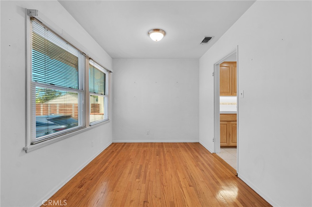2107 Jolley Drive Burbank, CA 91504 - Photo 9 of 33 an empty room with wooden floor and windows