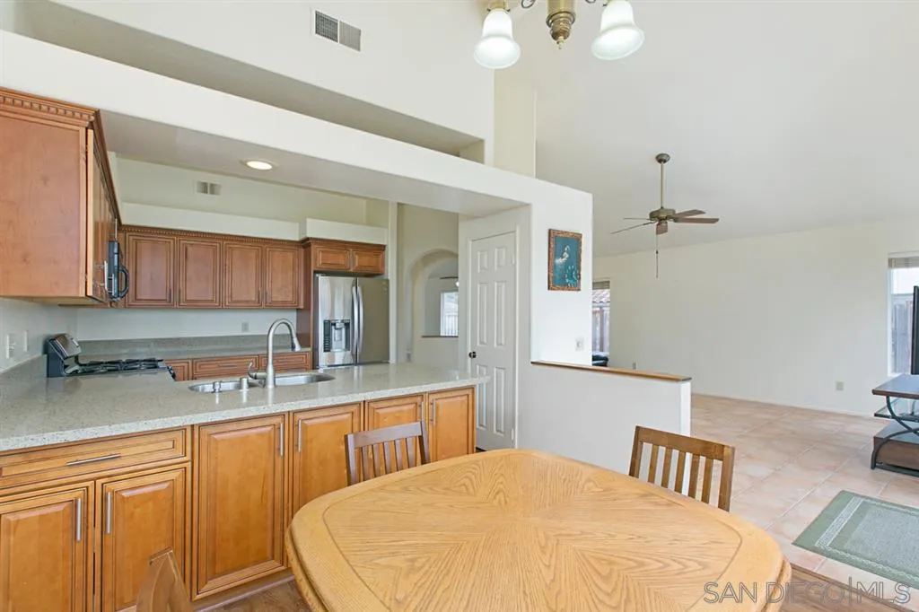 5064 Frazee Road Oceanside, CA 92057 - Photo 12 of 25 a bathroom with a sink and a mirror