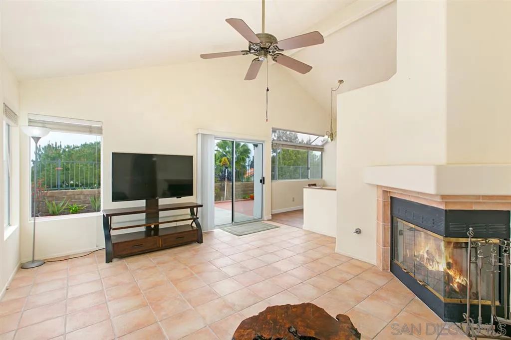5064 Frazee Road Oceanside, CA 92057 - Photo 14 of 25 a living room with furniture and a flat screen tv
