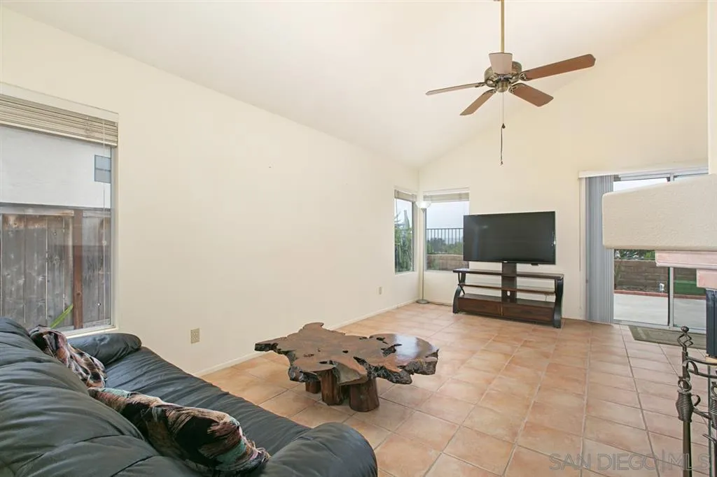 5064 Frazee Road Oceanside, CA 92057 - Photo 15 of 25 a living room with furniture and a flat screen tv