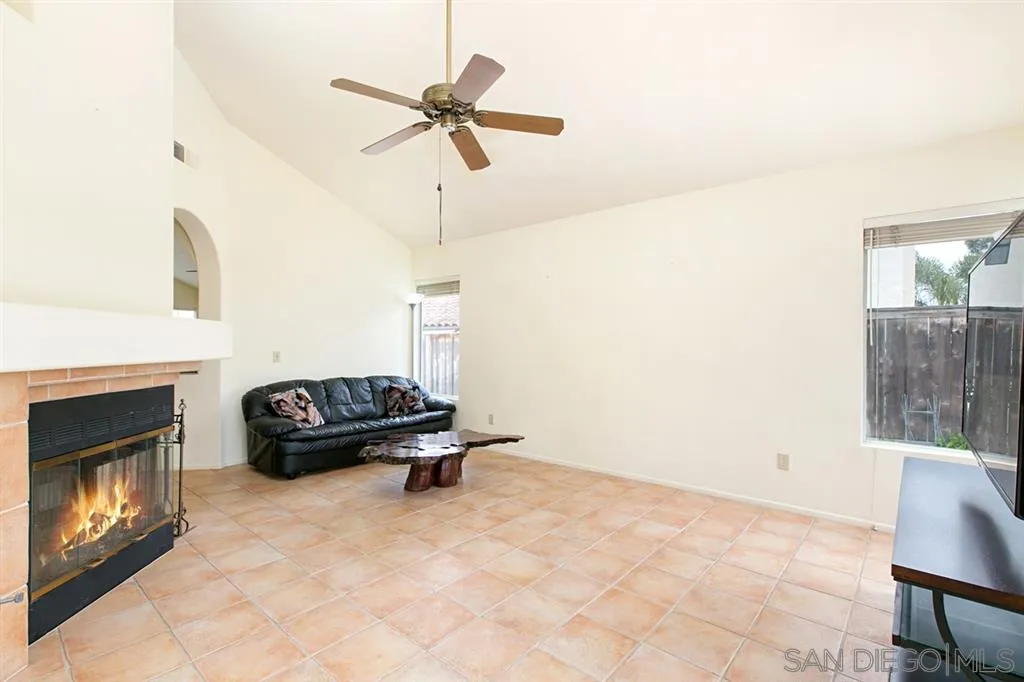 5064 Frazee Road Oceanside, CA 92057 - Photo 16 of 25 a living room with furniture and a fireplace
