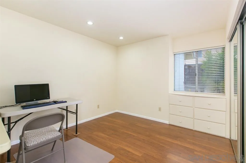 5064 Frazee Road Oceanside, CA 92057 - Photo 21 of 25 a view of workspace with wooden floor windows