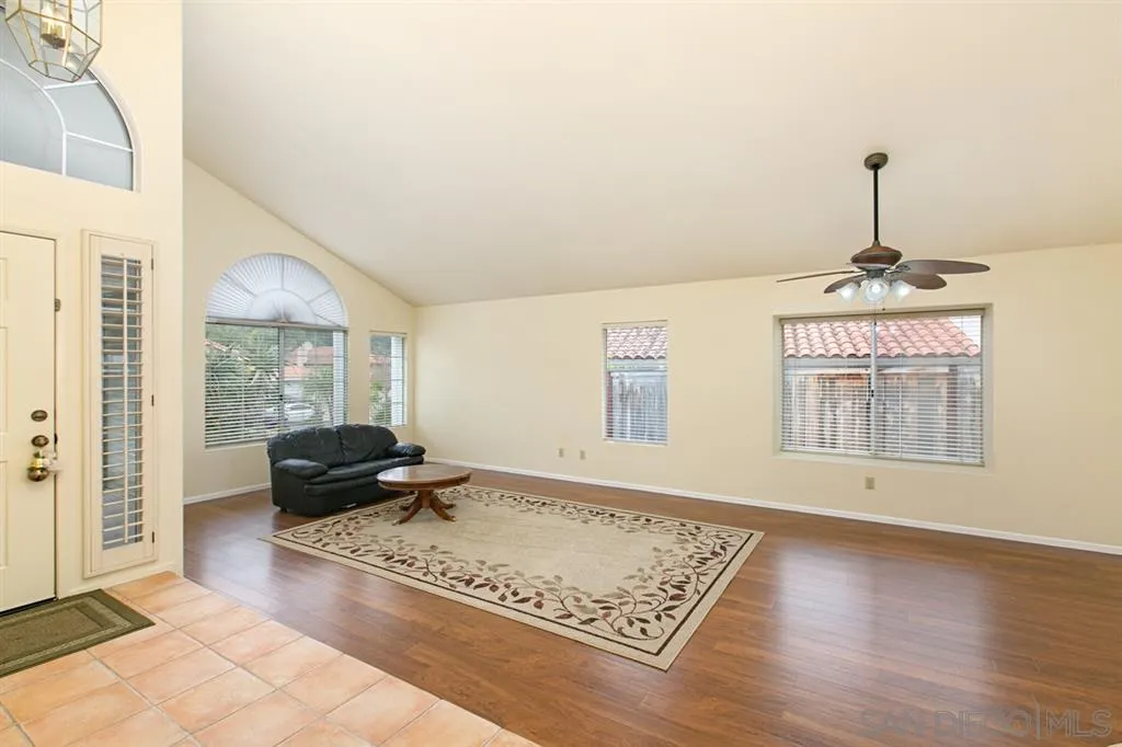 5064 Frazee Road Oceanside, CA 92057 - Photo 8 of 25 a living room with furniture window and wooden floor