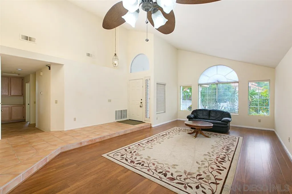 5064 Frazee Road Oceanside, CA 92057 - Photo 9 of 25 a living room with a bed furniture and a large window