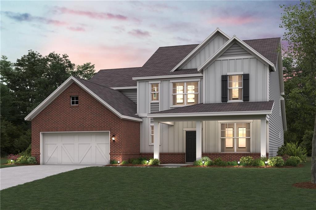 6620 Meriwether Road Dawsonville, GA 30534 - Photo 1 of 1 a front view of a house with a yard and garage