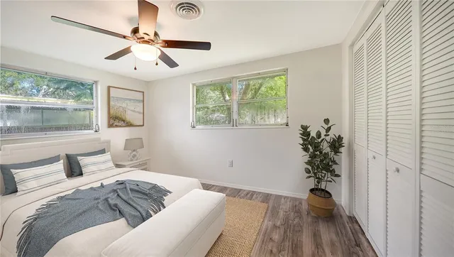 a bedroom with a large bed and a window