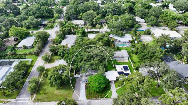an aerial view of house with yard