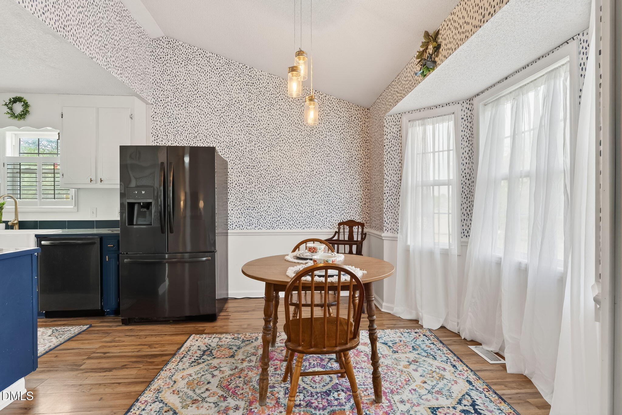 1101 Live Oak Road Coats, NC 27521 - Photo 6 of 29 a kitchen with stainless steel appliances granite countertop a refrigerator a sink a stove and a refrigerator with wooden floor