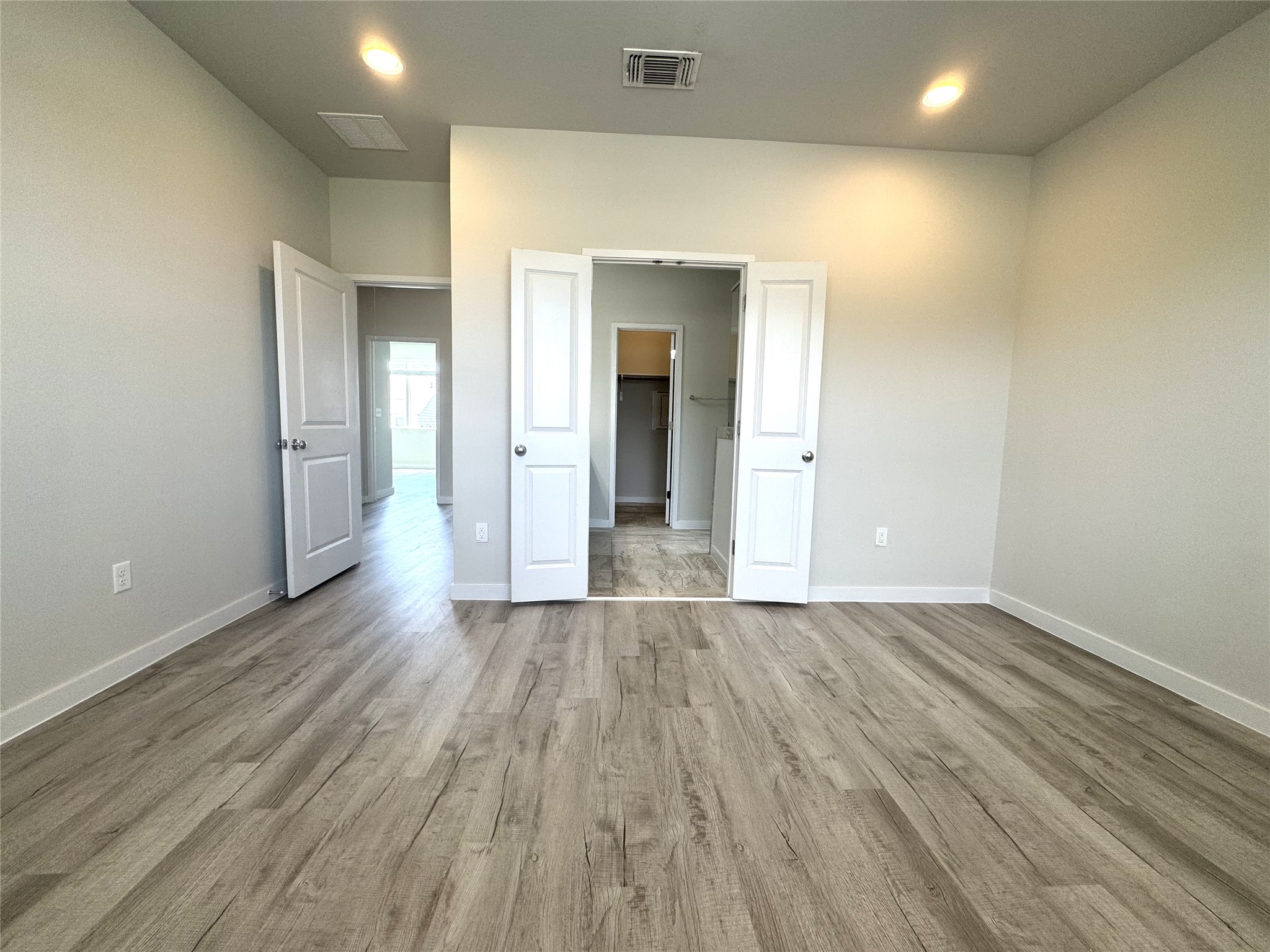 15102 Ryman Road Pflugerville, TX 78660 - Photo 10 of 12 an empty room with wooden floor and closet