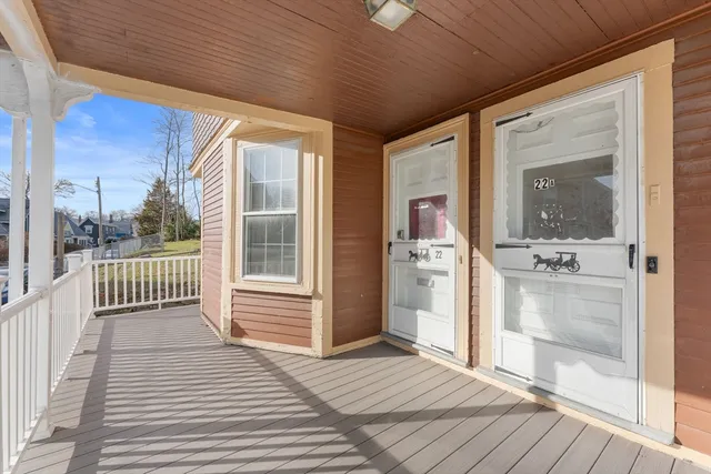 a view of a balcony with wooden floor