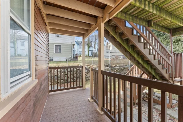 a view of balcony with wooden floor