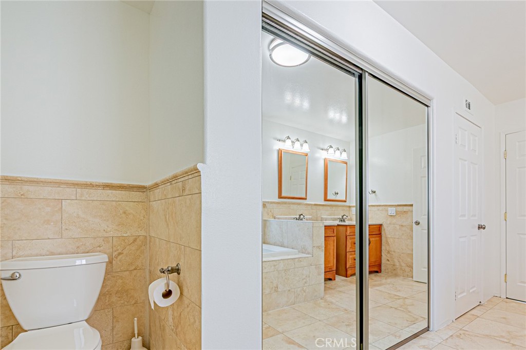 25533 Longfellow Place Stevenson Ranch, CA 91381 - Photo 25 of 47 a bathroom with a shower and toilet