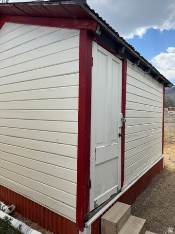 210 South State Street Moroni, UT 84646 - Photo 20 of 23 Utility building with horizontal siding and a corrugated metal foundation