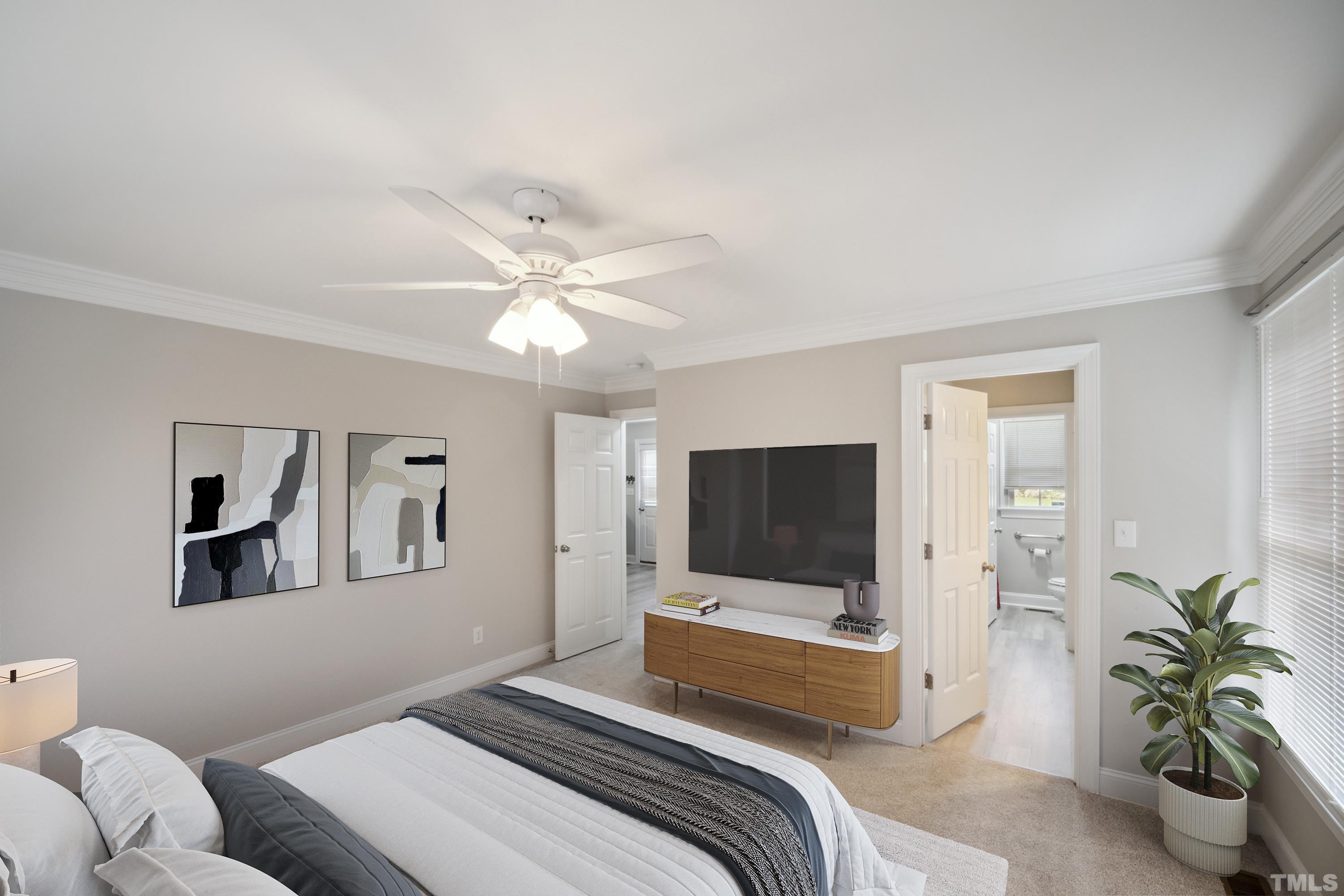 2131 Antioch Church Road Roxboro, NC 27574 - Photo 16 of 26 a bedroom with a bed and a flat screen tv