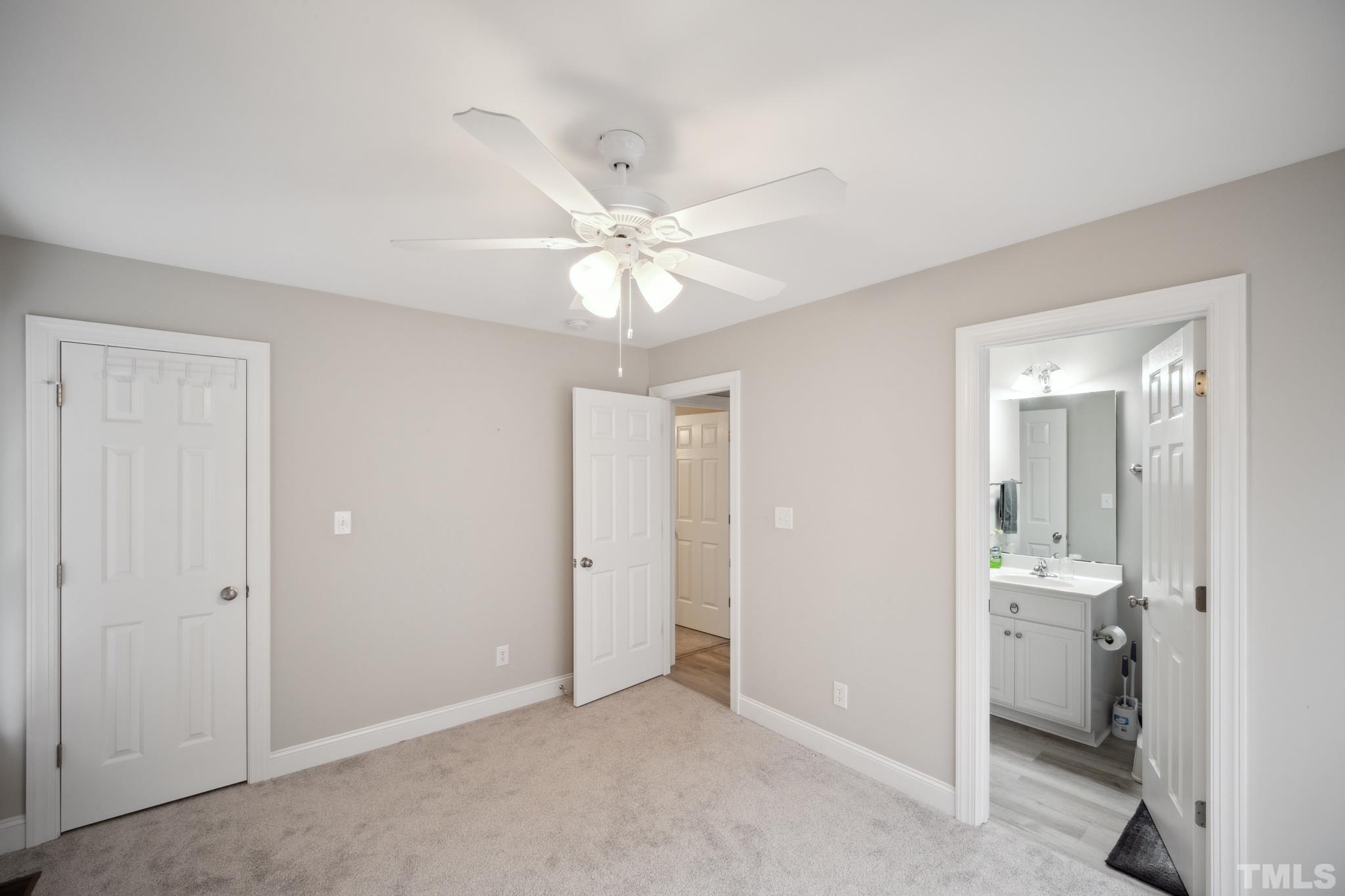 2131 Antioch Church Road Roxboro, NC 27574 - Photo 17 of 26 a view of a bathroom with a sink and a mirror