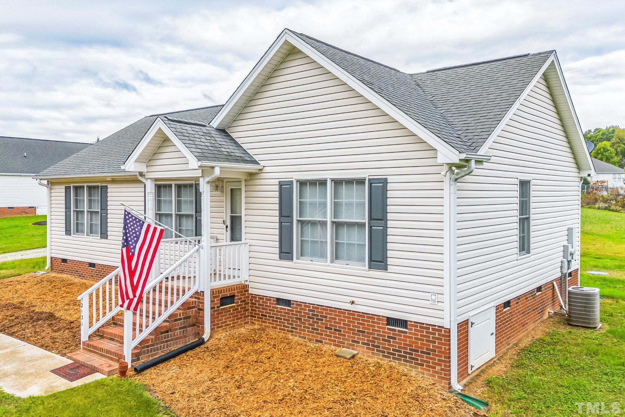 2131 Antioch Church Road Roxboro, NC 27574 - Photo 26 of 26 a view of house with a backyard and balcony