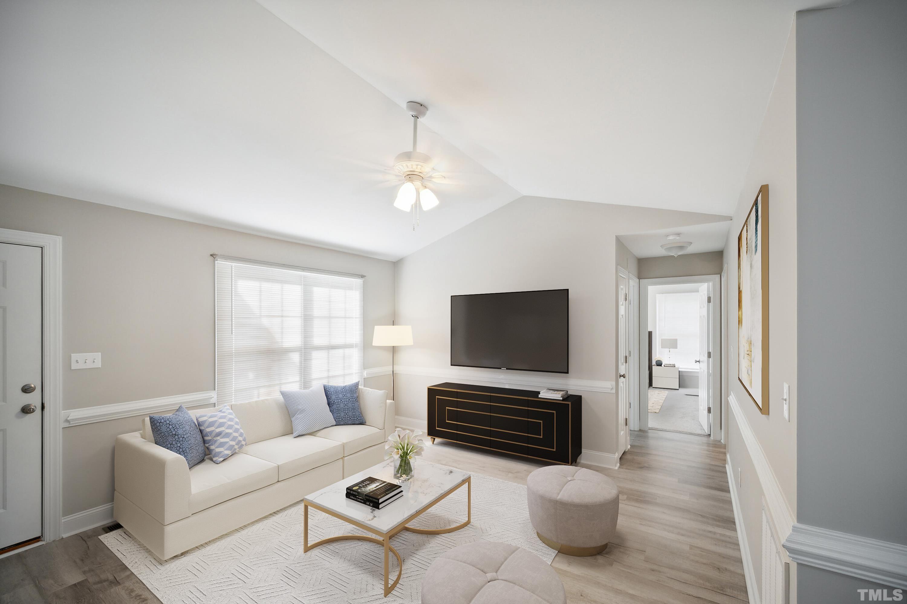 2131 Antioch Church Road Roxboro, NC 27574 - Photo 5 of 26 a living room with furniture a fireplace and a flat screen tv