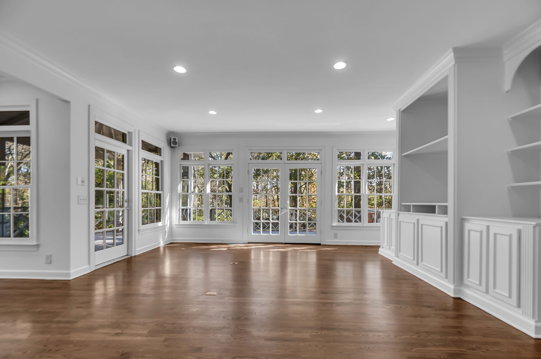 4206 Sneed Road Nashville, TN 37215 - Photo 21 of 56 a view of an empty room with wooden floor and a window