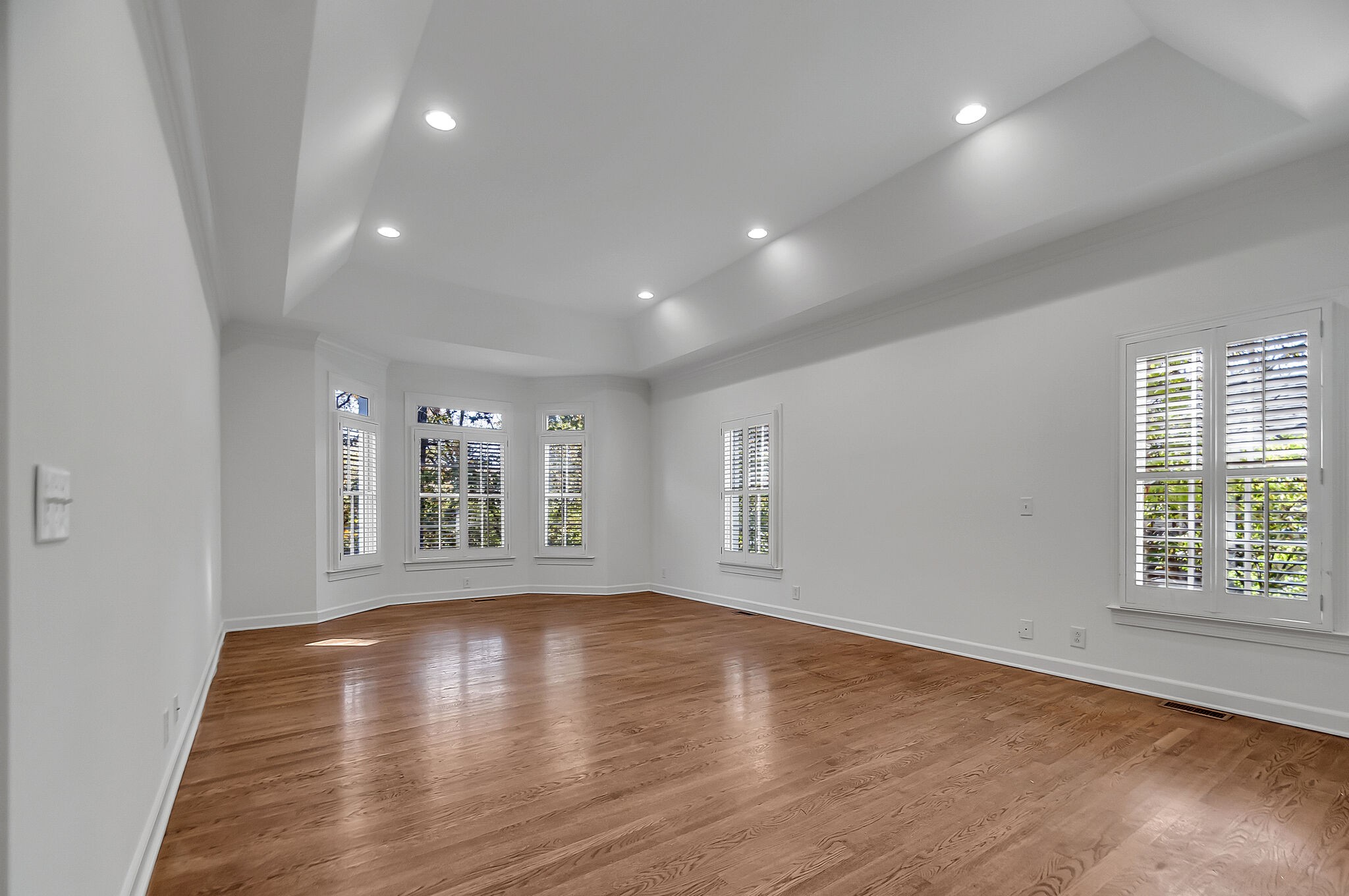 4206 Sneed Road Nashville, TN 37215 - Photo 23 of 56 a view of an empty room with wooden floor and a window