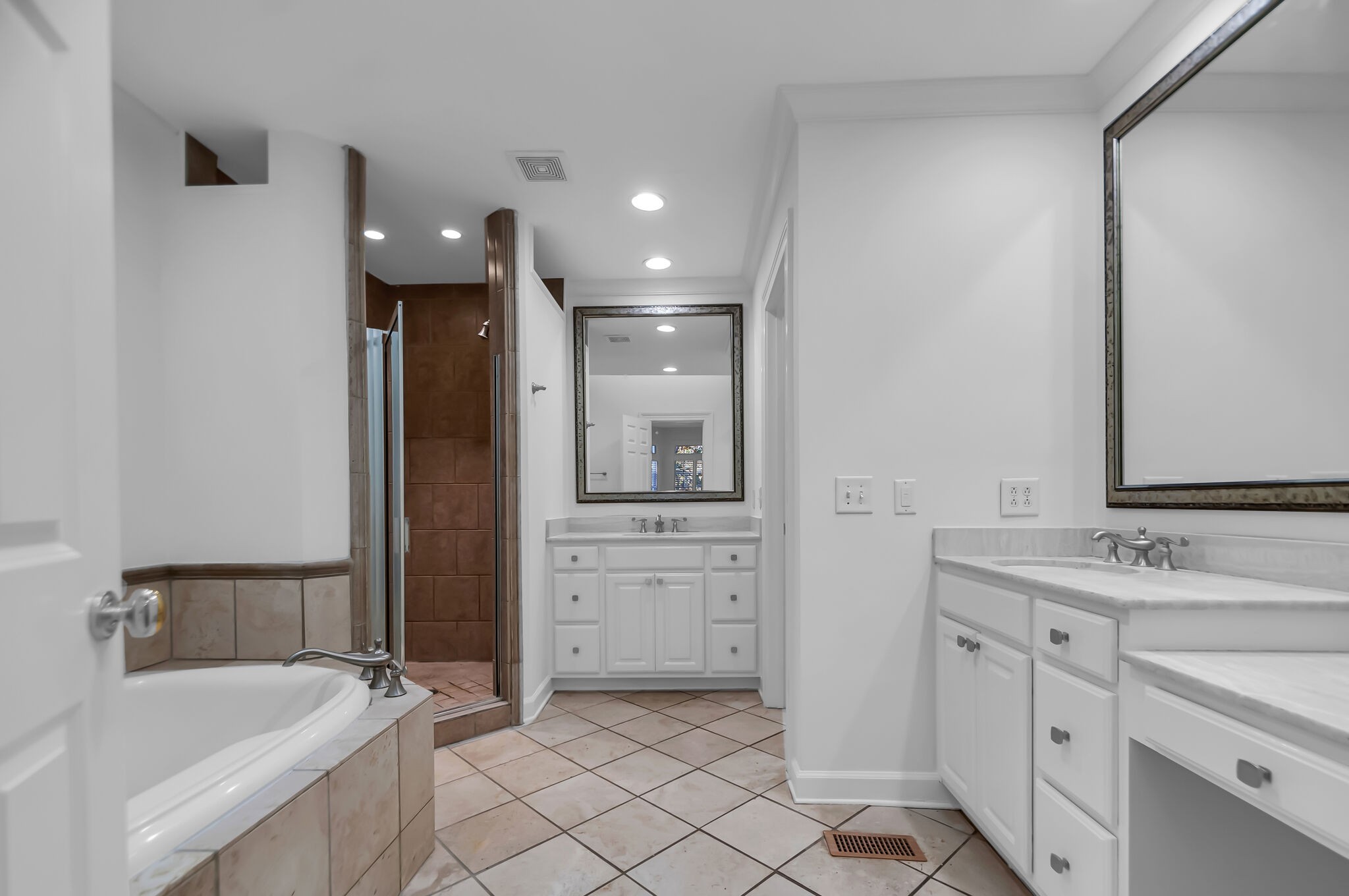 4206 Sneed Road Nashville, TN 37215 - Photo 24 of 56 a bathroom with a tub sink and mirror