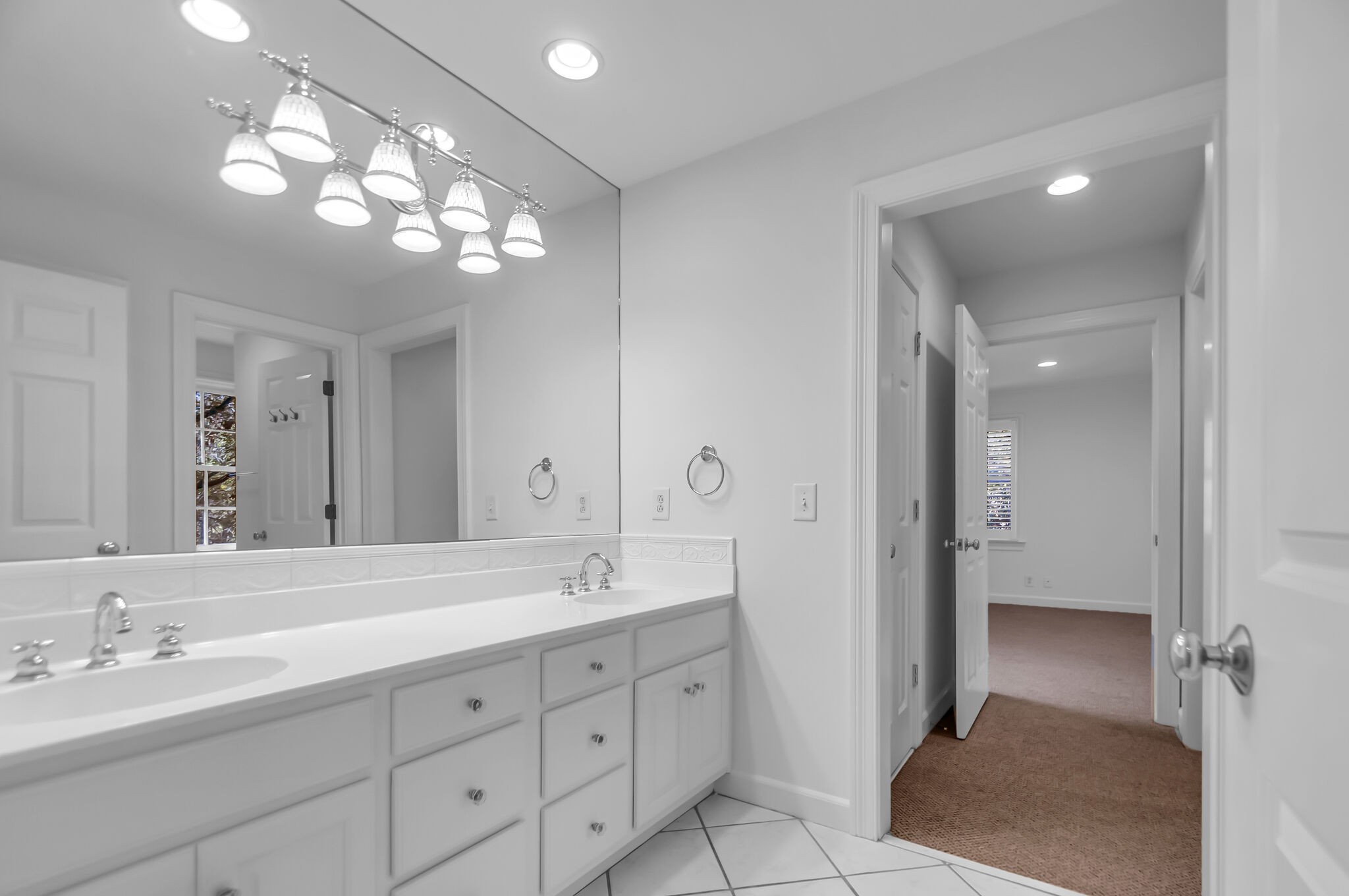 4206 Sneed Road Nashville, TN 37215 - Photo 35 of 56 a spacious bathroom with double vanity a mirror and a shower
