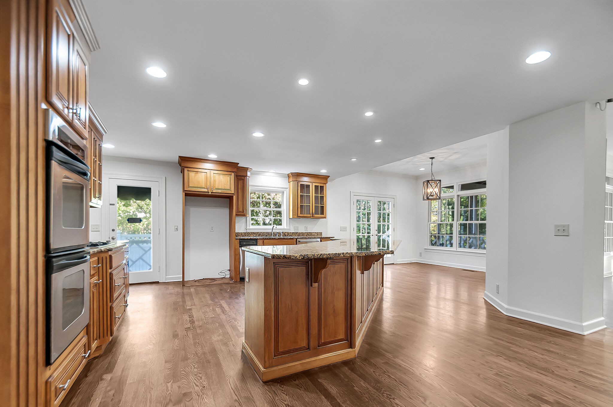 4206 Sneed Road Nashville, TN 37215 - Photo 9 of 56 a view of a kitchen with furniture and wooden floor
