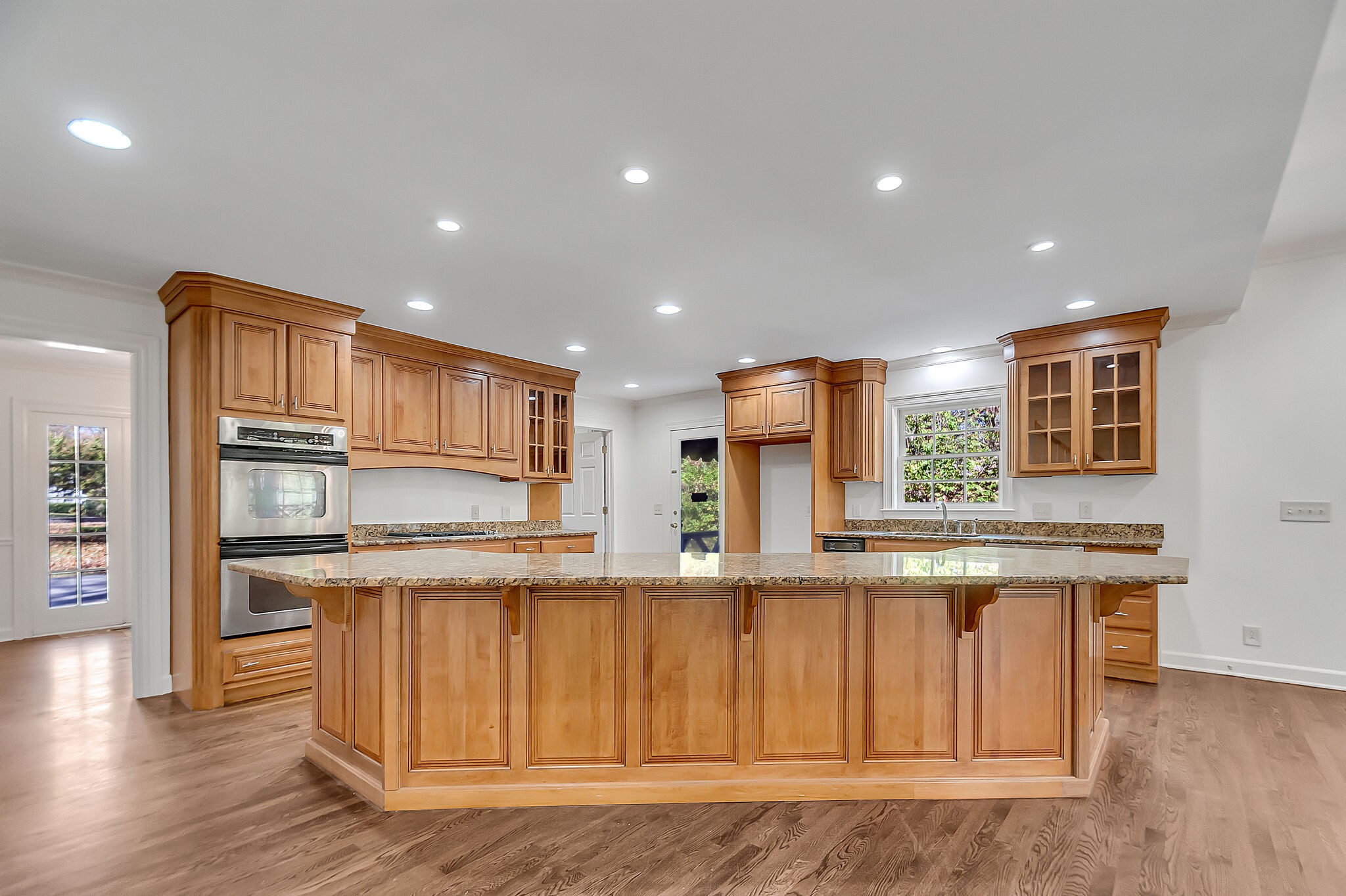 4206 Sneed Road Nashville, TN 37215 - Photo 10 of 56 a kitchen with kitchen island wooden cabinets and refrigerator