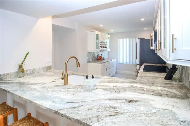 a view of a kitchen counter space and a sink