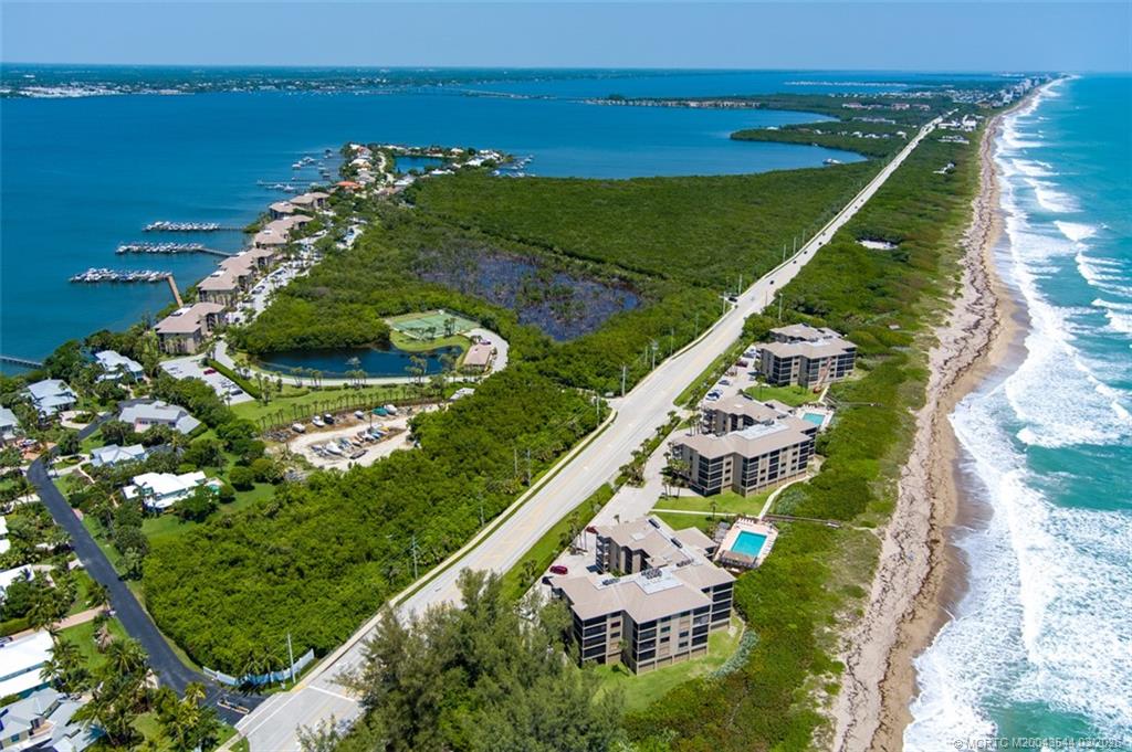4440 Northeast Sandpebble Trace, Unit 201 Jensen Beach, FL 34957 - Photo 32 of 32 a view of a city and an ocean view