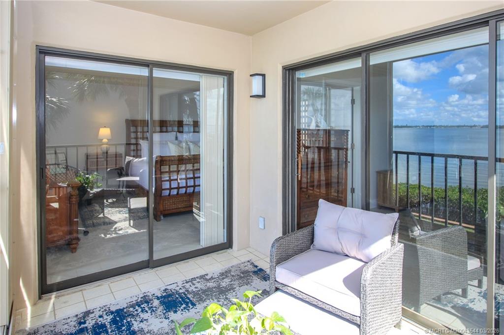 4440 Northeast Sandpebble Trace, Unit 201 Jensen Beach, FL 34957 - Photo 5 of 32 a living room with furniture