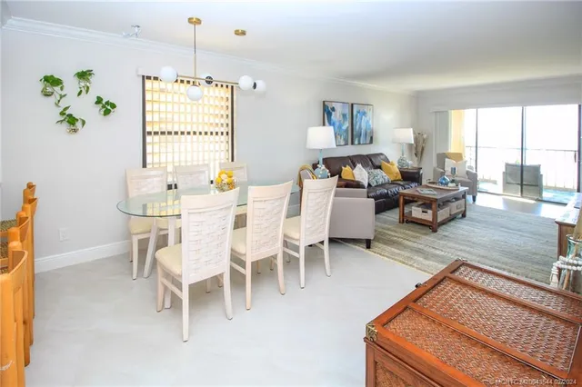 a living room with furniture a fireplace and a table