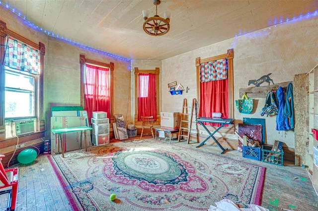 a room with window and furniture