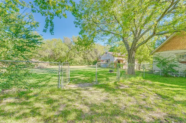 a view of outdoor space with trees all around