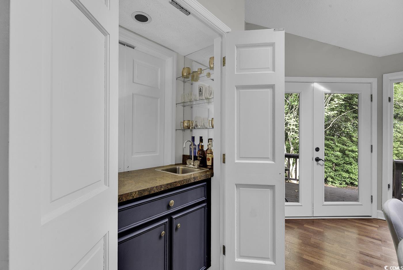 1305 Forest View Road Conway, SC 29526 - Photo 11 of 40 Indoor wet bar featuring vaulted ceiling and wood finished floors