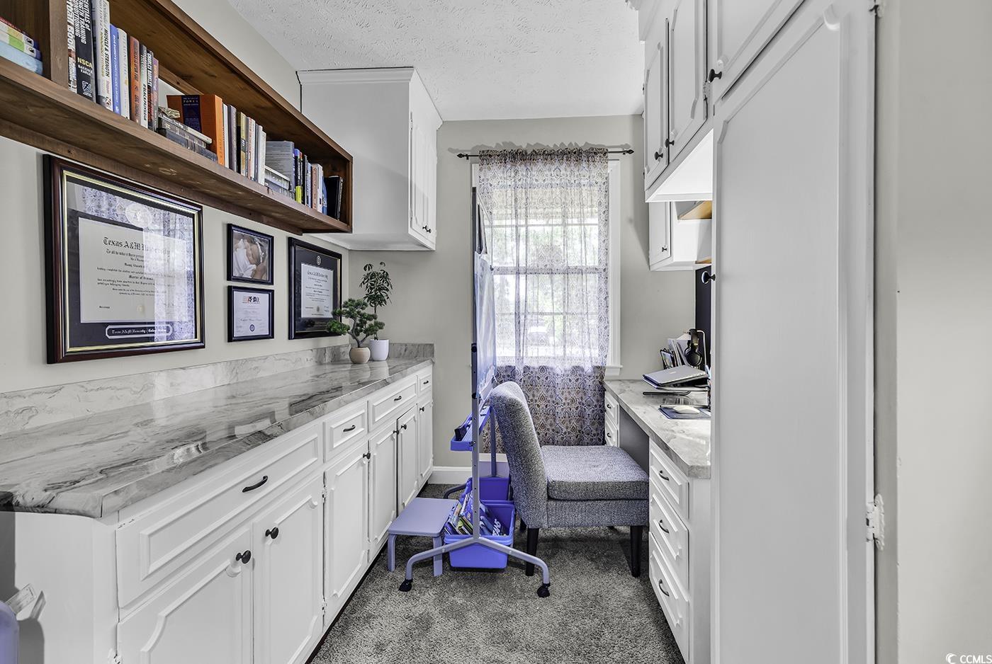 1305 Forest View Road Conway, SC 29526 - Photo 16 of 40 Office space featuring carpet floors, a textured ceiling, and built in desk