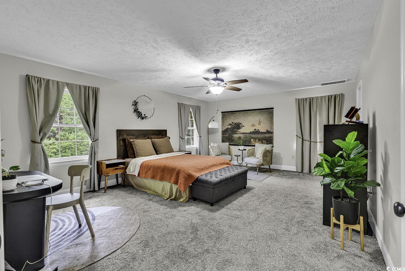 1305 Forest View Road Conway, SC 29526 - Photo 18 of 40 Carpeted bedroom with baseboards, a ceiling fan, and a textured ceiling