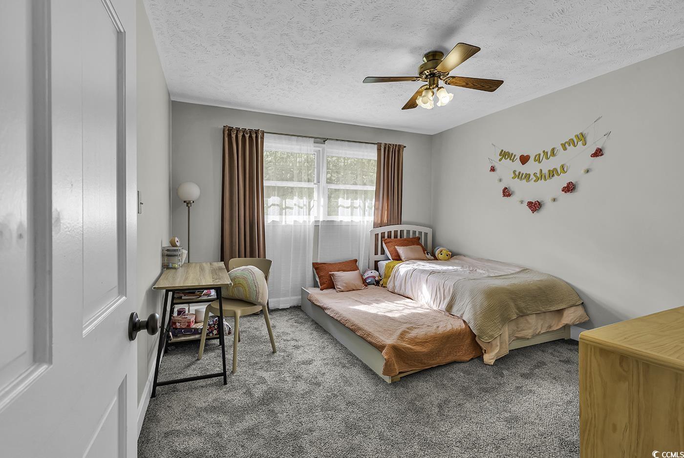 1305 Forest View Road Conway, SC 29526 - Photo 26 of 40 Bedroom featuring carpet floors, a textured ceiling, and a ceiling fan